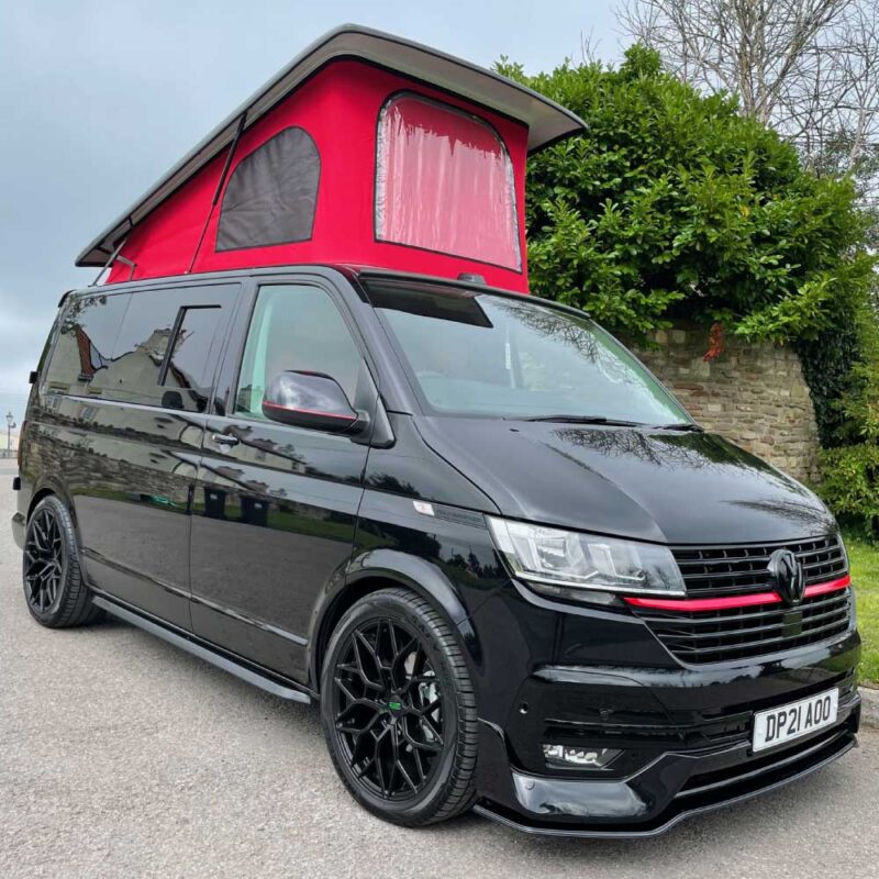 Gold package — black VW Transporter with red STORM pop-top roof